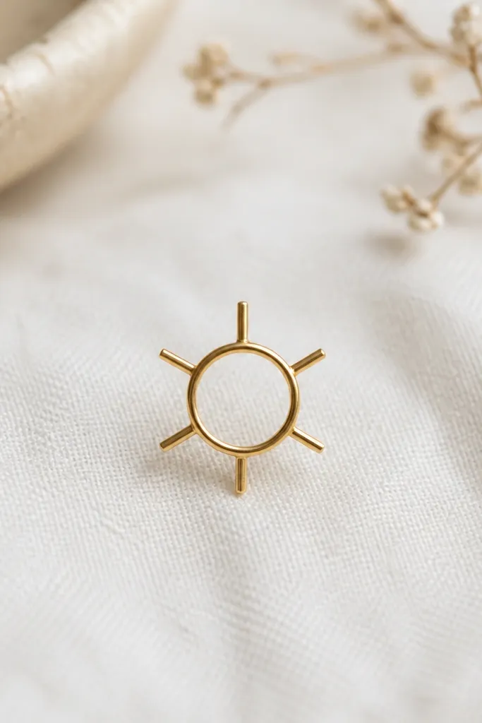 A small circular stencil ring with exactly six thin rays sticking out evenly. The rays are short and straight, and the ring is narrow.