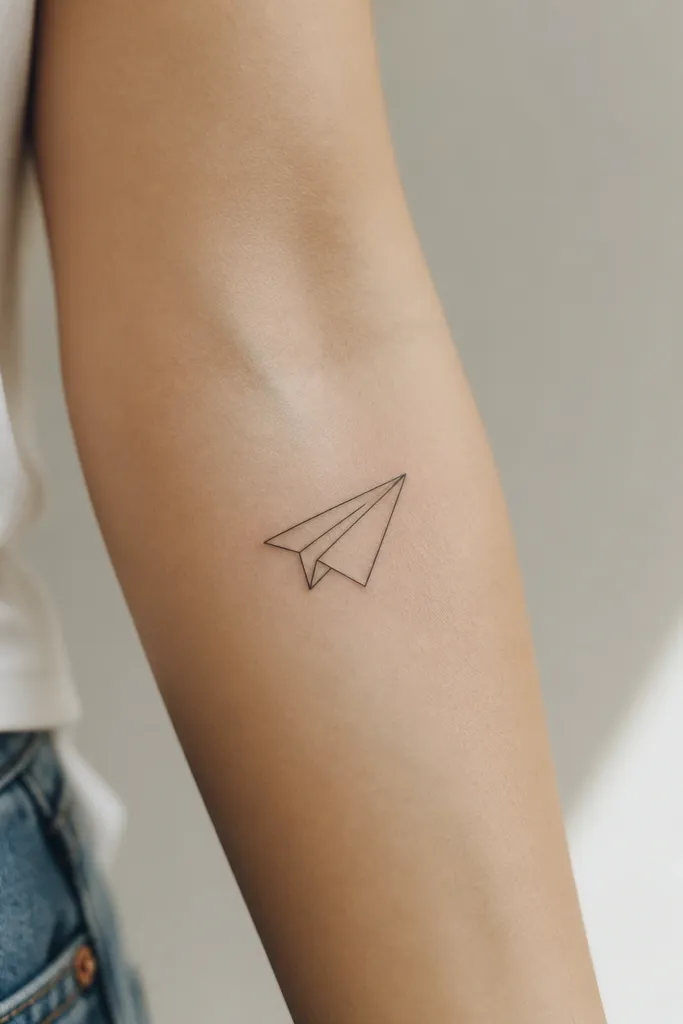 A minimalist paper plane outline with one small diagonal fold line inside the wing, drawn in thin black on the forearm.