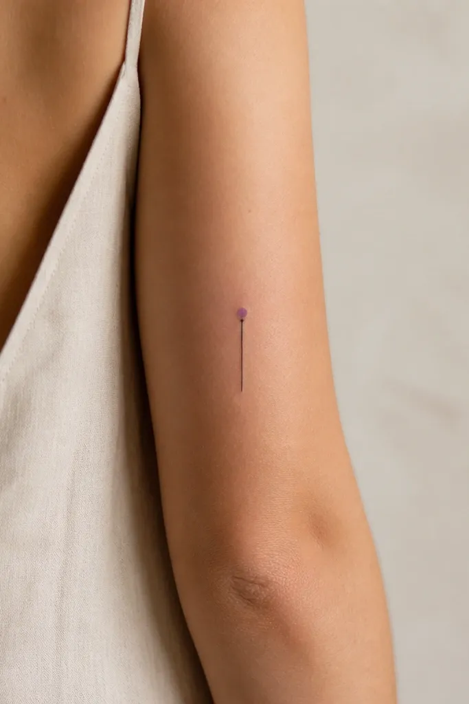 A minimalist black stem line with one small lavender-violet dot at the top, on the back of the upper arm.